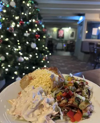 a plate of food with rice and a christmas tree at The Star Inn in Saint Erth
