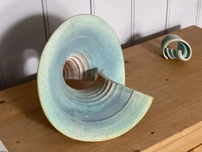 a vase sitting on top of a wooden table at 9 Bowling Green Terrace in St Ives