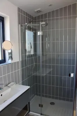 a bathroom with a shower and a sink at Cicero's Lodge in Padstow