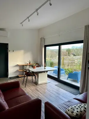 a living room with a couch and a table at Cicero's Lodge in Padstow