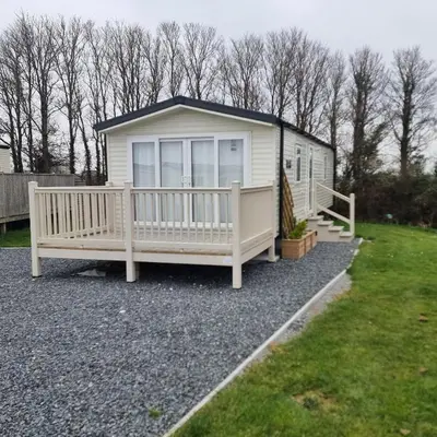 a tiny house sitting on top of a pile of gravel at 7 Bays 6 Berth Willerby Molton Caravan in St Merryn