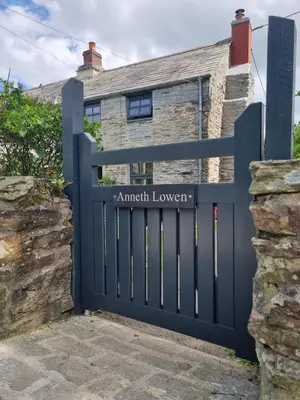 a gate in front of a house with the words amritologue at North Cornwall character cottage, sleeps 5, close to coast in Delabole