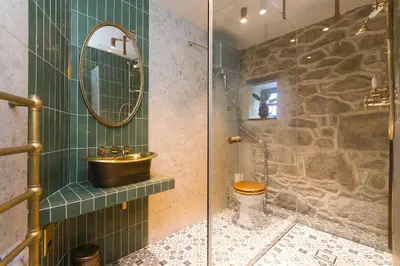 a bathroom with a sink and a toilet and a mirror at She Sells Sanctuary in St Ives
