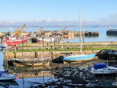 a group of boats are docked in a harbor at Sea View Loft in Penzance
