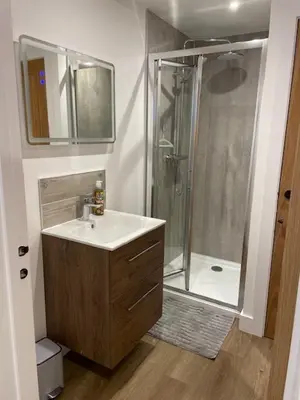 a bathroom with a sink and a shower at Hednes Barn in Crowan