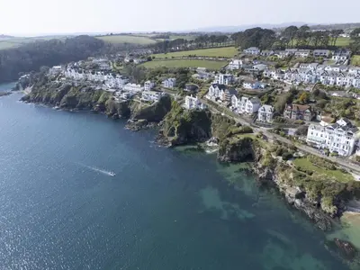 an aerial view of a town next to the water at Dolly's Plaice, Fowey in Fowey