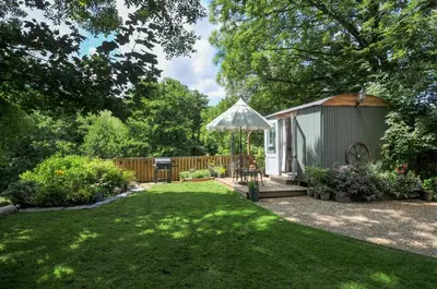 a gazebo in a garden with a yard at The Highwood Hut in Liskeard