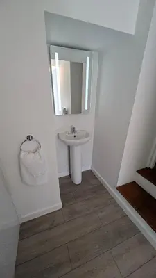 a bathroom with a sink and a mirror at Duke of Cornwall in St Austell