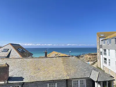 a view of the ocean from the roofs of buildings at Chy Meor - a stonesthrow away from Porthmeor Beach in St Ives