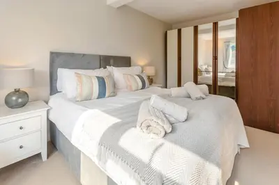 a bedroom with two beds with towels on them at 4 Bed in St. Keverne oc-t31085 in Saint Keverne