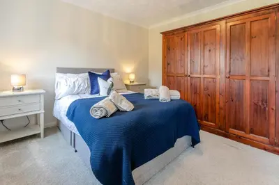 a bedroom with a bed with towels on it at 4 Bed in St. Keverne oc-t31085 in Saint Keverne
