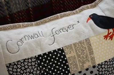 a bird sitting on a quilt with the words congratulations emperor at The Barn At Collacott in North Petherwin