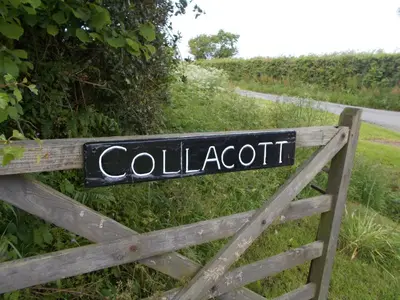 a sign that reads colloat on a wooden gate at The Barn At Collacott in North Petherwin