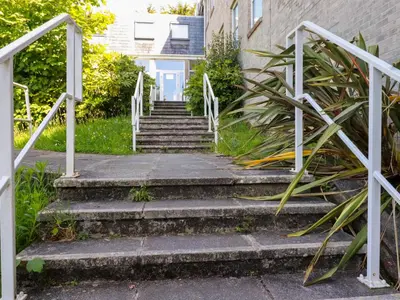 a set of stairs leading up to a building at Priory in St Austell