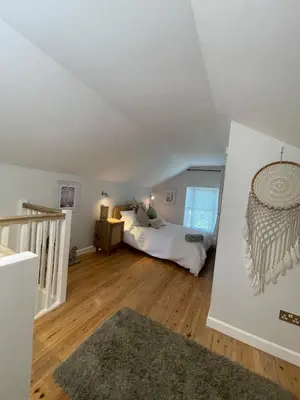 a bedroom with a bed in a room at Gorgeous cottage for couples & small families in Saint Columb Minor