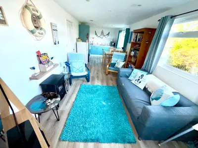 a living room with a couch and a rug at 5 Berth Chalet Holiday Apartment in Cornwall in Padstow