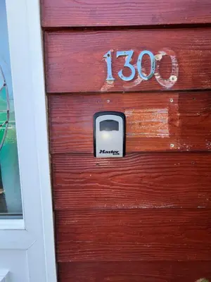 a wooden door with the number on it at 5 Berth Chalet Holiday Apartment in Cornwall in Padstow