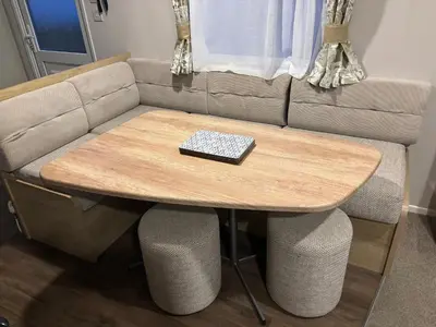 a couch with a wooden table and a keyboard on it at Two bedroom Holiday Home with countryside view in St Austell