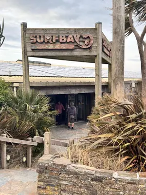 a sign for the entrance to the sunbathers at Sunset Serenity in Perranporth