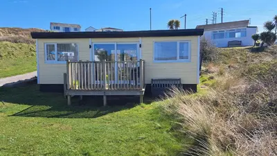 a tiny house on the side of a hill at D48 Sunvale, Riviere Towans in Hayle
