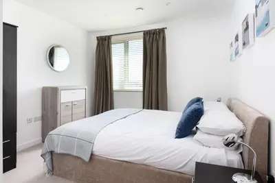 a bedroom with a bed and a window at 32 One Lusty Glaze in Newquay in Newquay