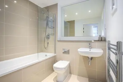 a bathroom with a toilet and a sink and a mirror at 32 One Lusty Glaze in Newquay in Newquay