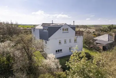an aerial view of a white house at Schoopers - Holiday Home in Rock in Padstow