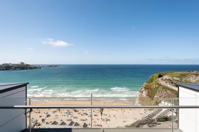 a view of the beach from a balcony at 26 Cliff Edge Penthouse in Newquay in Newquay