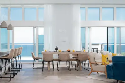 a dining room with a table and chairs at 26 Cliff Edge Penthouse in Newquay in Newquay