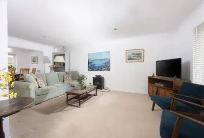 a living room with a couch and a tv at 3 Menague in Padstow