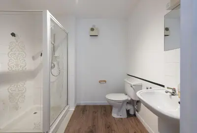 a bathroom with a toilet and a shower and a sink at 3 Menague in Padstow