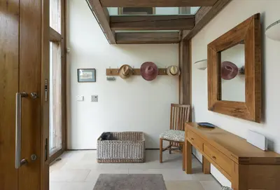 a room with a wooden desk and a mirror at Gull Rock in Padstow