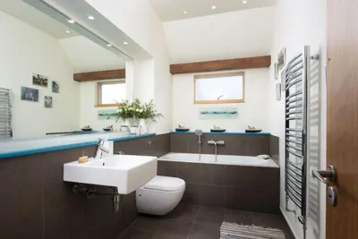 a bathroom with a sink and a toilet and a tub at Gull Rock in Padstow
