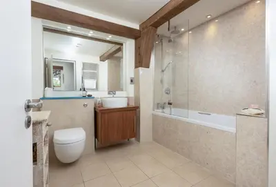 a bathroom with a shower and a toilet and a sink at Gull Rock in Padstow