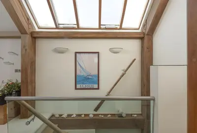 a skylight in a room with a glass ceiling at Gull Rock in Padstow