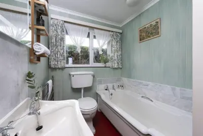a bathroom with a tub and a toilet and a sink at Rabbit Hill in Polzeath