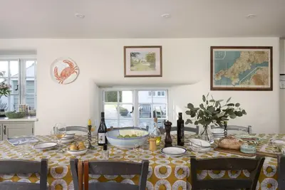 a dining room table with a bowl of food on it at Sparnal Stitch in Padstow