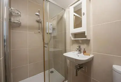 a bathroom with a shower and a sink at Tresevens in Polzeath
