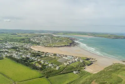 an aerial view of a beach with houses and the ocean at Robin in Polzeath