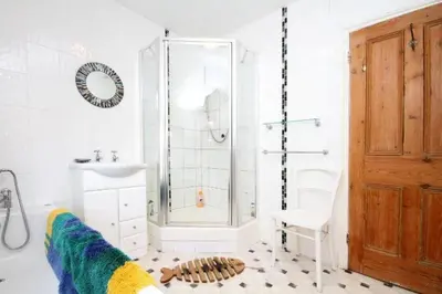 a bathroom with a shower and a sink at Trevose View in Polzeath