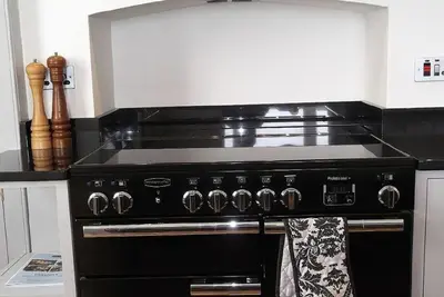 a black stove top oven in a kitchen at Trevose View in Polzeath
