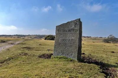 a stone sign in the middle of a field at Finest Retreats - Jubilee Barn Cottage at Bodmin Moor in Saint Breward