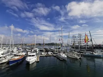 a bunch of boats are docked in a harbor at Falmouth Oasis with sub-tropical garden & parking in Falmouth