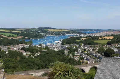 a view of a town with a river and a bridge at 5 Bedroom House with Sea Views in Penryn