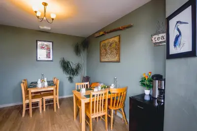 a dining room with a table and chairs at Smarties Guest House in Newquay