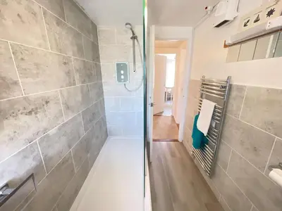 a bathroom with a shower and a walk in shower at The Lookout in St Ives