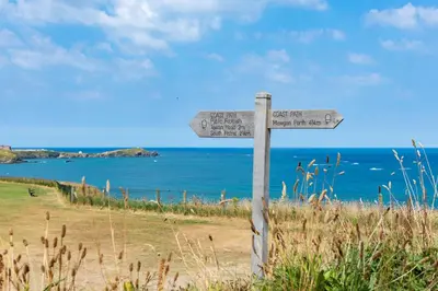 a street sign on the side of a beach at Number 2 in Lusty Glaze, Newquay in Newquay