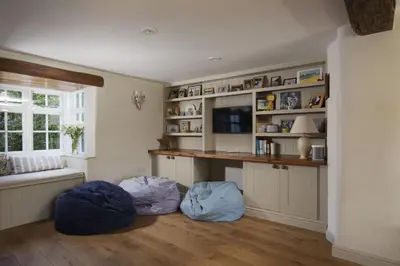 a living room with two bean bags on the floor at Sparnal Stitch and the Hideaway in Padstow