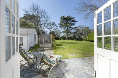 a view of a yard from the porch of a house at Sparnal Stitch and the Hideaway in Padstow