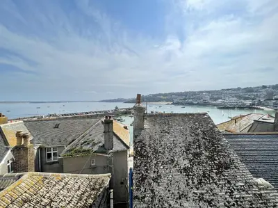 a view of the water from roofs of buildings at Upper Seaview in St Ives